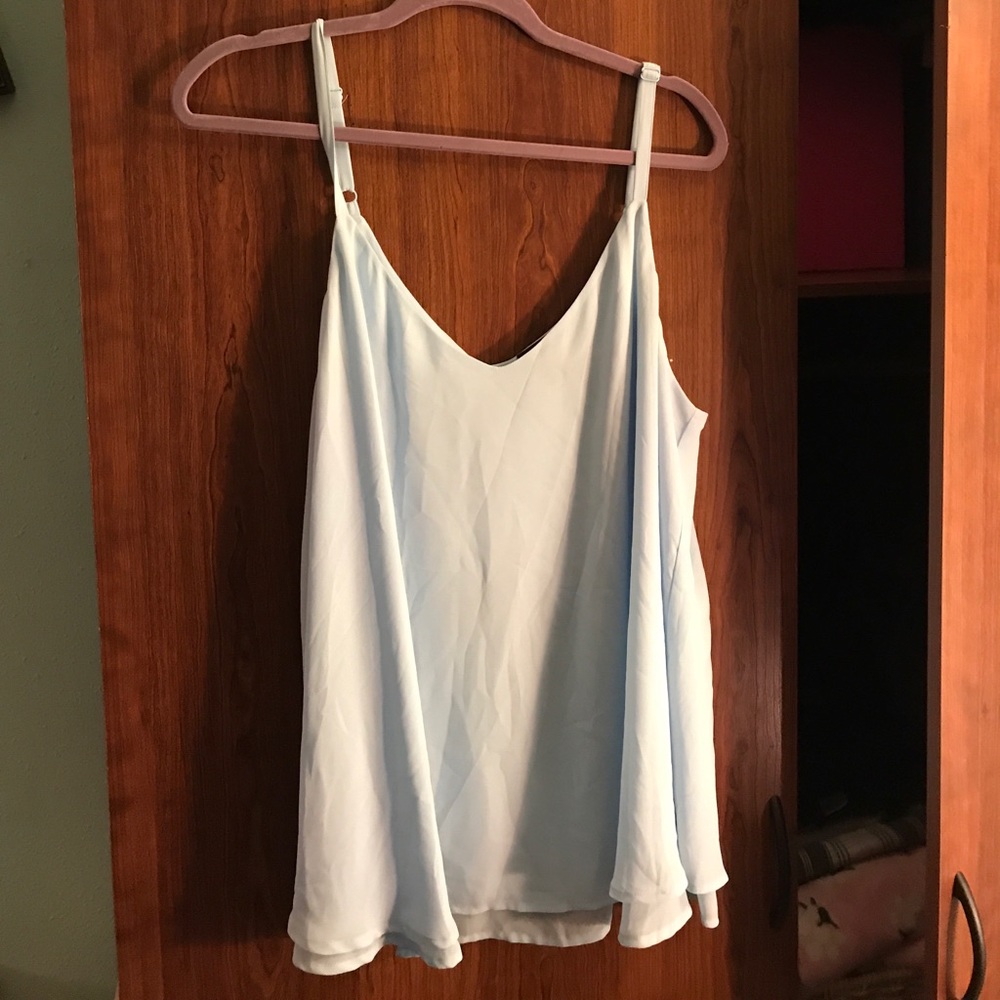 Beautiful light blue chiffon top w/ flyaway back.